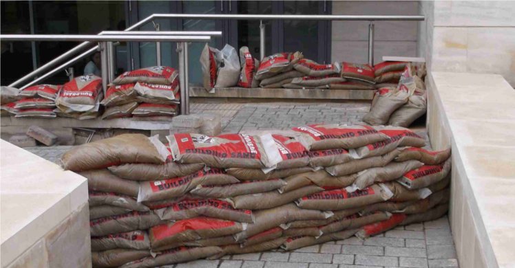 Sandbags arranged to provide temporary protection against flooding